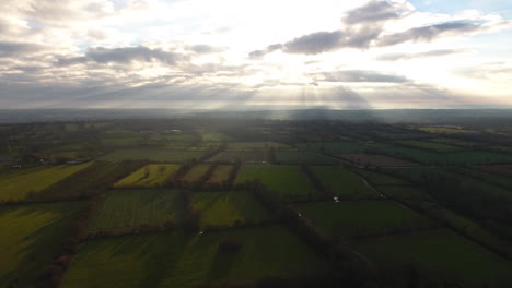 Normandy-fields-separated-by-hedges-and-ditches-sunset-time-with-clouds.-Aerial